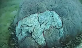 Researchers find a rock with a carving of a Mastodon at the underwater Stonehenge of Lake Michigan